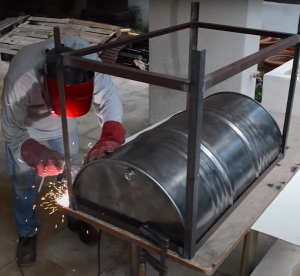 Image of a welder welding a braai pit