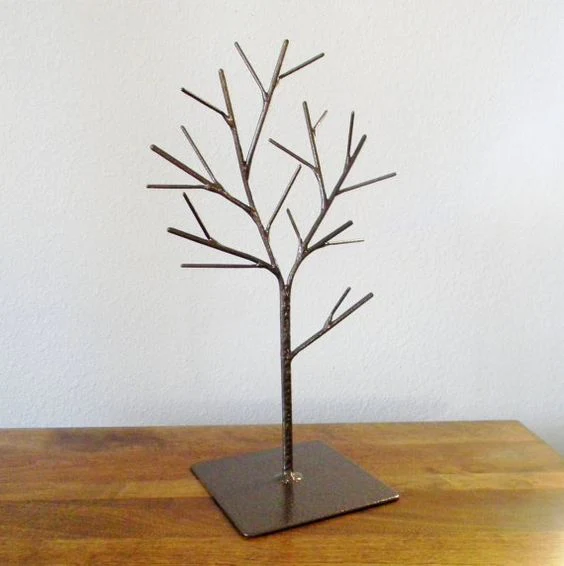 A metal shaped tree jewellery holder