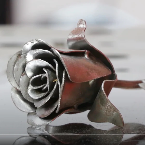 An image of a rose head made out of sheet metal