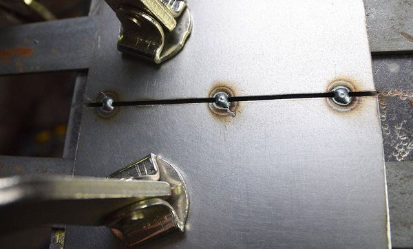 Image showing spaced out tack welds welding two pieces of metals together