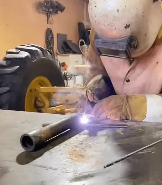 Image of a welder stick welding cast iron