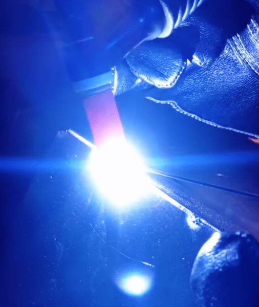 Image of a welder using a tig torch and comsumables to tig weld aluminium